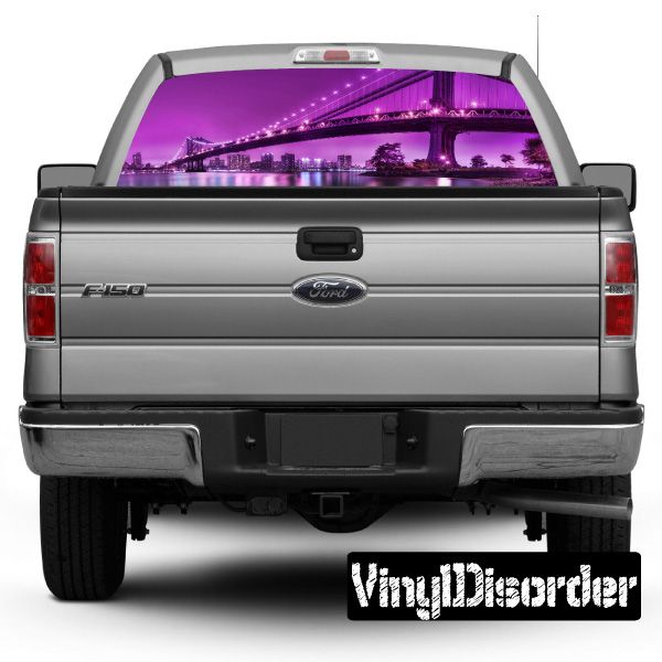 Rear window graphic decal with purple city skyline on pickup truck tailgate view