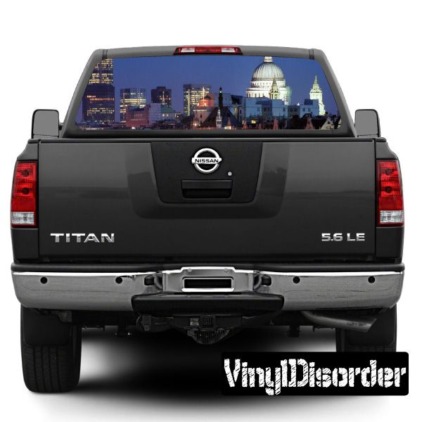 Rear window view graphic featuring a London skyline scene on a dark pickup truck