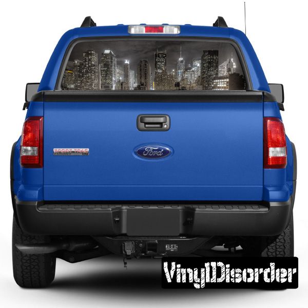 Blue pickup truck rear view with graphic rear window and tailgate