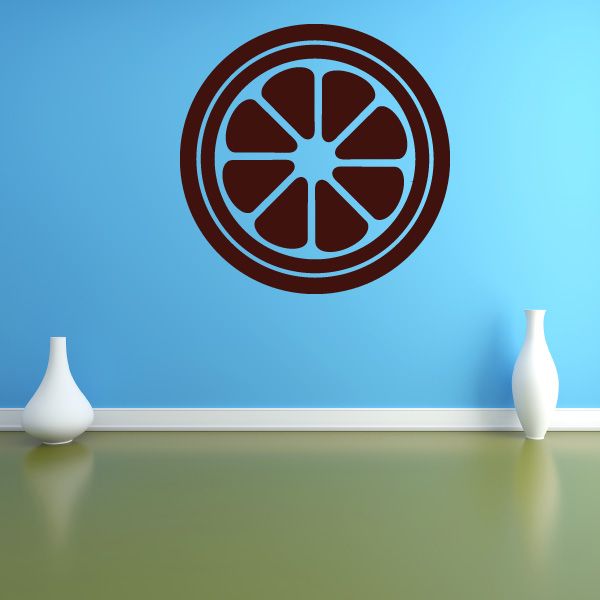 Lime slice decal with circular segmented fruit design in brown and blue