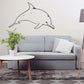 Dolphin wall decal with thin black outline, smiling swimming posture