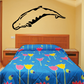 Beluga whale wall decal with bold black outline and smiling face, curved fins
