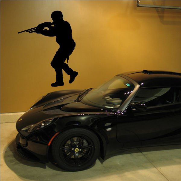 Gun-wielding soldier decal silhouette on car hood