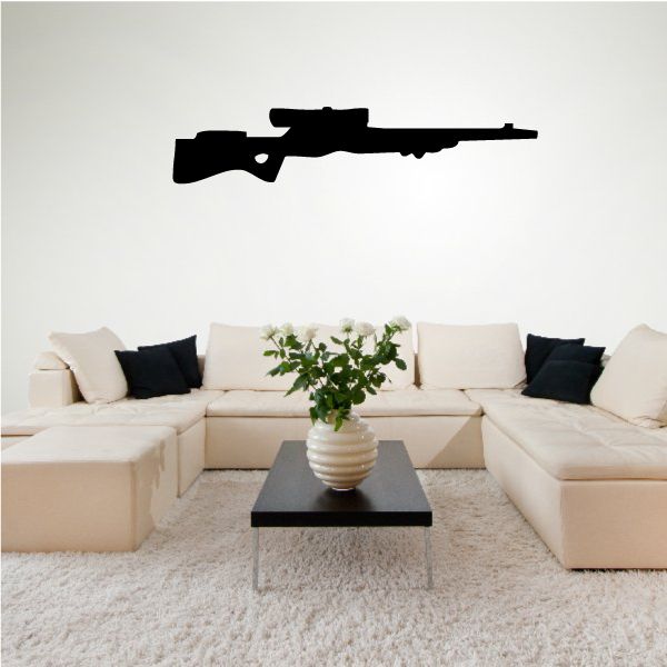 Black sniper rifle wall decal silhouette above sofa