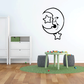 Crescent moon wall decal with star accents and sleeping face outline