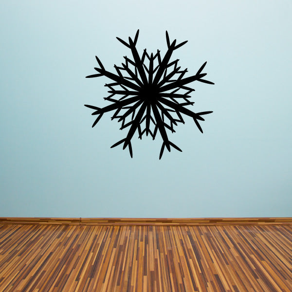 Adhesive fractal detailed snowflake decal on a wall