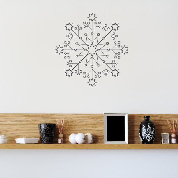 Adhesive snowflake decal on a bedroom wall