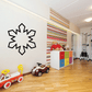 Playful snowflake decal in a room with a toy car on the floor