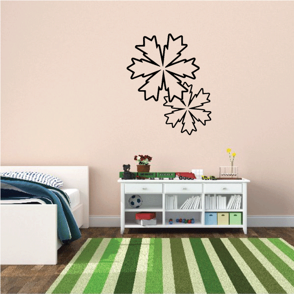 A serene child's bedroom with a Snowflake Decal over a green rug beside a white bed