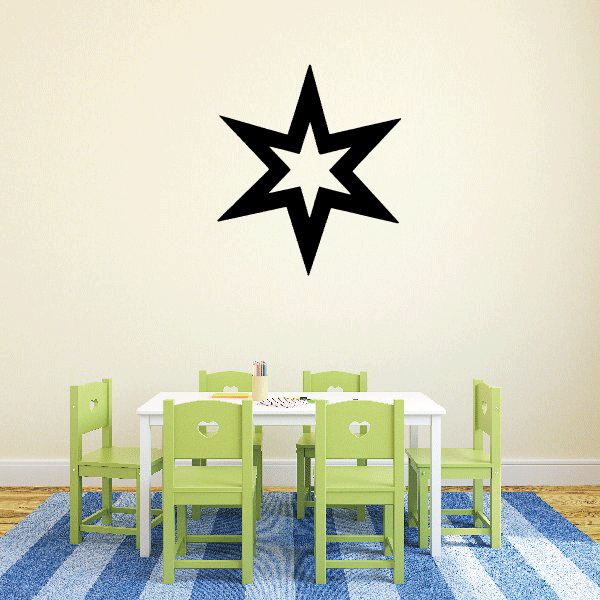 A room adorned with a snowflake wall sticker near furniture