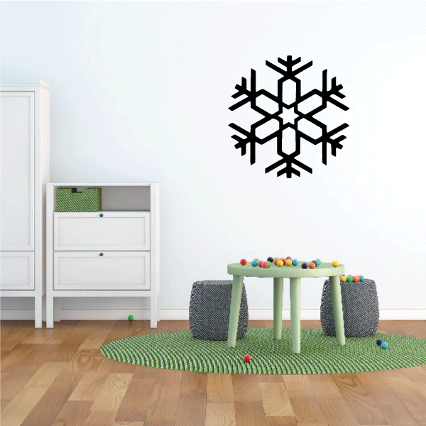 A cozy bedroom atmosphere with a snowflake decal as a focal point