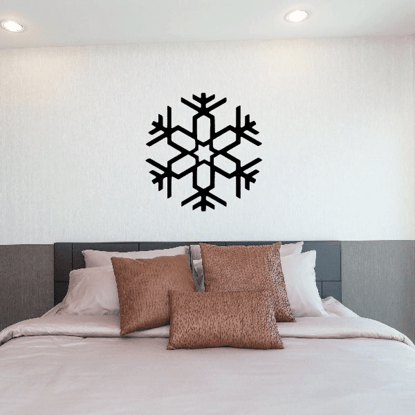 A cozy bedroom atmosphere with a snowflake decal as a focal point