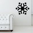 Elegant living room with a snowflake decal above a white sofa