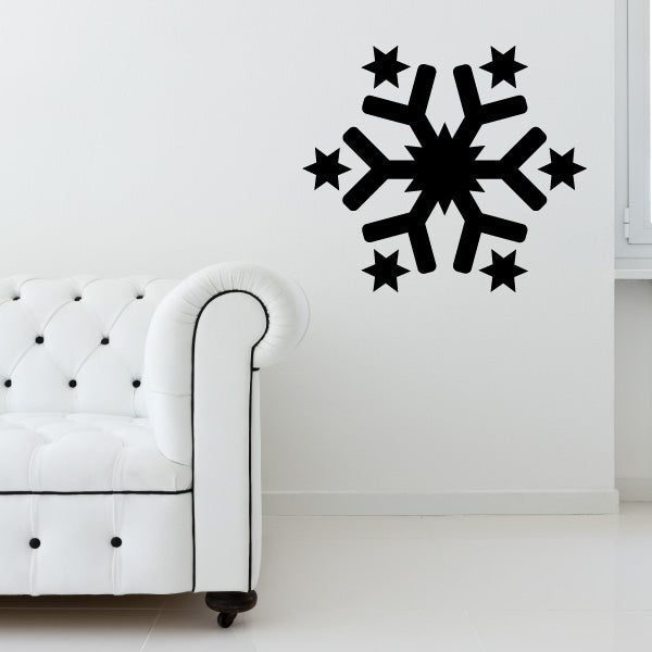 Elegant living room with a snowflake decal above a white sofa