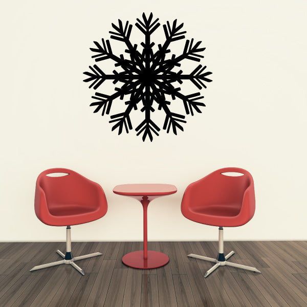 Close-up of a snowflake wall sticker on a textured surface