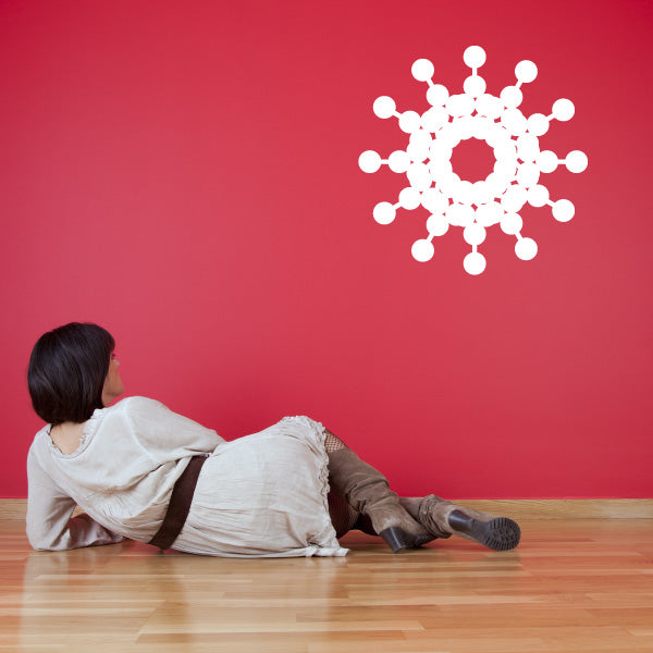 Snowflake wall decal in a room with red accents