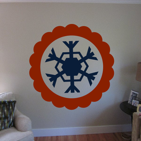 Snowflake sticker set with orange scalloped frame and dark blue snowflake