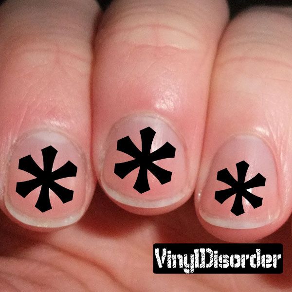 Snowflake nail art stickers with black snowflake decals on nude nails