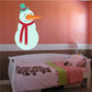 Snowman wall sticker with teal hat, orange carrot nose, and red scarf