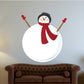 Snowman sticker with red scarf, round white body and raised stick arms