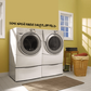 Wall decal with black text: "SOAK WASH RINSE DRY FLUFF FOLD"