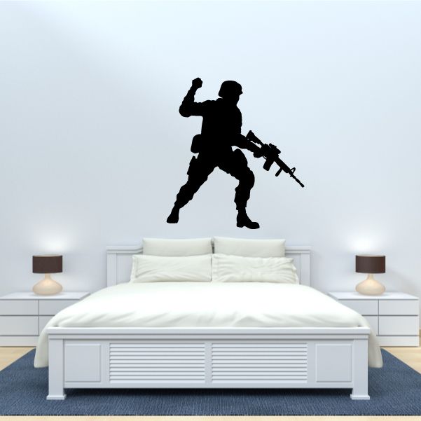 Soldier commander wall decal of a standing armed soldier silhouette with rifle