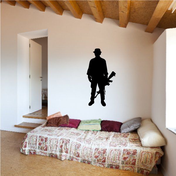 Soldier holding gun decal, black silhouette on clear background