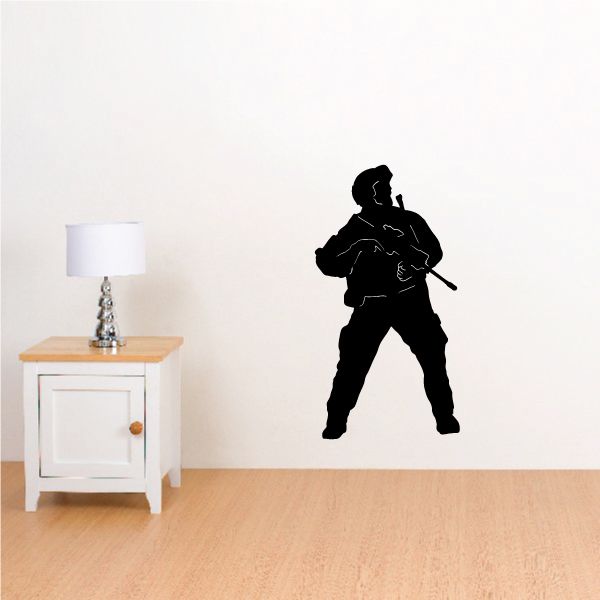 Soldier looking wall decal with black silhouette holding a rifle