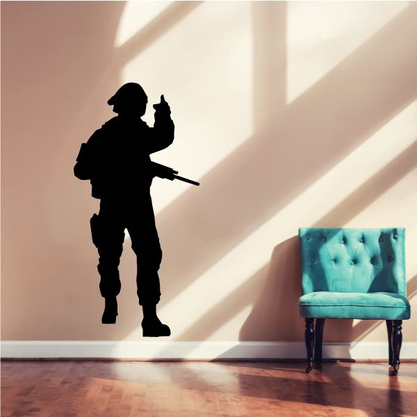 Soldier pointing decal, black soldier silhouette holding rifle and pointing forward