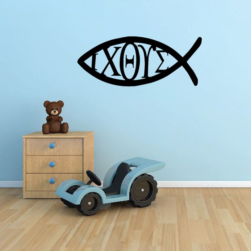 Black fish-shaped decal with decorative lettering and cross-style marks