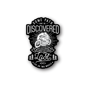 Motorcycle vinyl sticker, black badge with text 'DISCOVERED' and rider on motorcycle