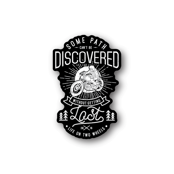 Motorcycle vinyl sticker, black badge with text 'DISCOVERED' and rider on motorcycle
