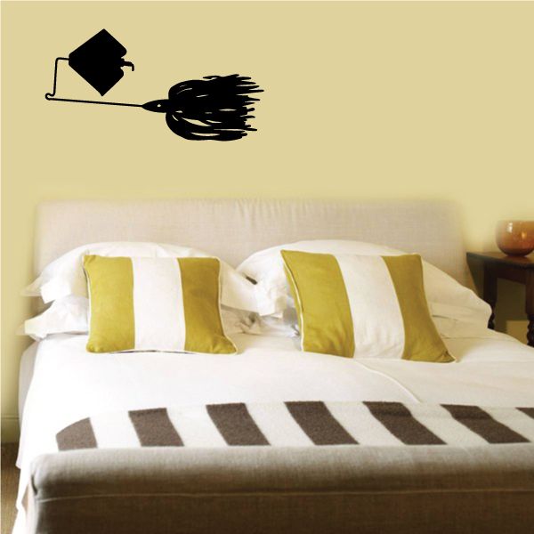 Fishing lure decal with black spinner lure and hook icon above striped bedding