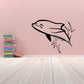 Dolphin wall decal in light gray with black outline and splash motion, plus seaweed