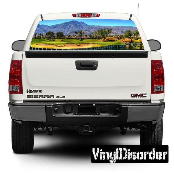 Vehicle rear window view graphic decal on pickup truck, with colorful golf scene
