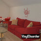 Red scorpion wall decal with spread legs and curved tail.