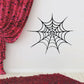 Spider web decal with radial black web strands and pointed ends