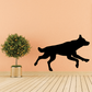 Sprinting wolf decal with black silhouette of a running wolf.