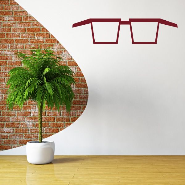 Square glasses decal with red frames on a white wall