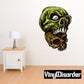 Green stacked skull sticker with white eye sockets and fanged grin, black text logo