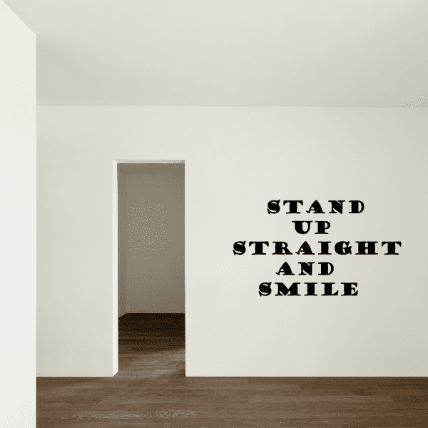Wall decal text reading "STAND UP STRAIGHT AND SMILE" in bold uppercase lettering