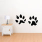 Standing animal track decals, set of black paw prints on wall