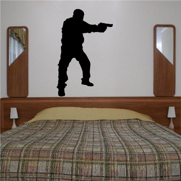 Standing soldier silhouette wall decal, pointing a handgun