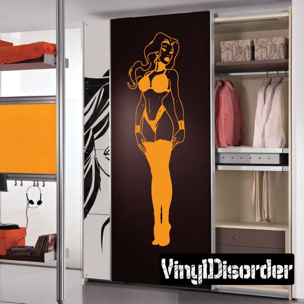 Princess decal of a standing woman in yellow with crown and flowing hair.