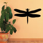 Black dragonfly wall decal with slender body and four outstretched wings