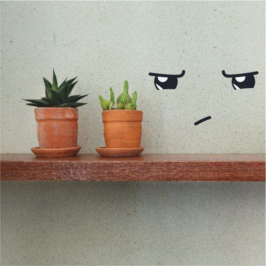 Vinyl wall decal with two cartoon black eyes and small mouth line