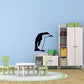 Penguin wall decal, stooping black-and-white design with white border