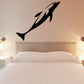 Dolphin dive wall decal with three black dolphin shapes