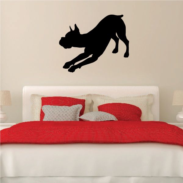 Stretching dog decal with a black silhouette in a leaping pose