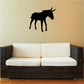 Striding donkey wall decal, black silhouette of a striding donkey on a wall.